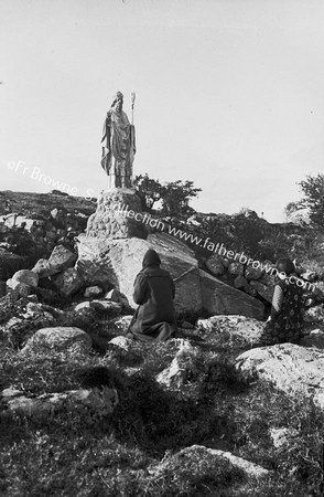 PRAYING AT THE MASS ROCK